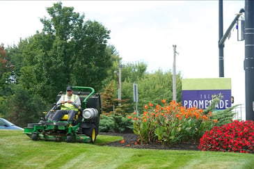 maintenance crew mowing commercial property